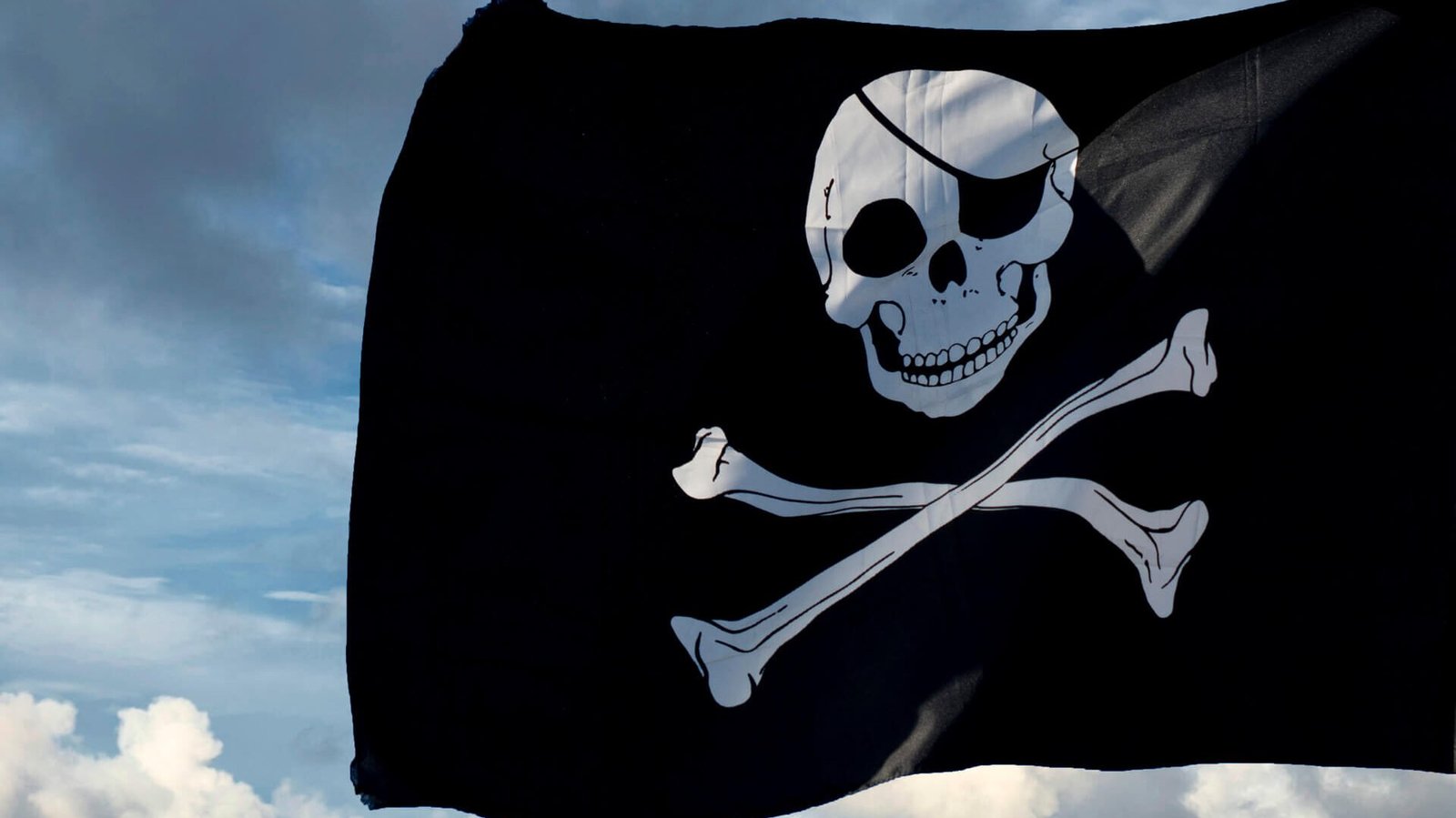 A black and white pirate flag with a skull and crossbones.